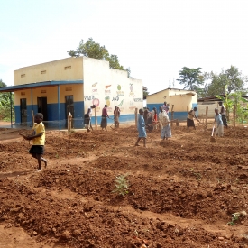 The Centre's residents prepare a field for planting.