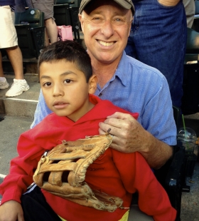 Charlie with son Uli, at Uli\'s first baseball game.