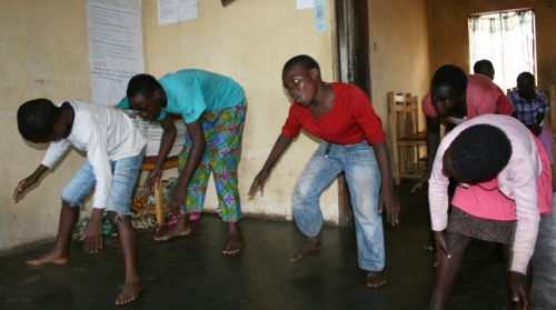 Kids at the orphanage rehearse a breakdancing routine