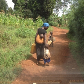 A Ugandan family goes for water.