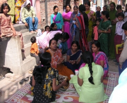 Women gather for HOPE worldwide-sponsored training in a New Dehli slum.