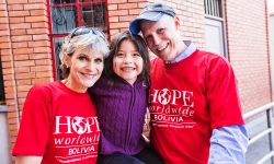 HOPE worldwide Bolivia program leaders Noelle and Kevin Broyles (with a young Bolivian).