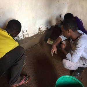 EarthEnable masons installing a floor.