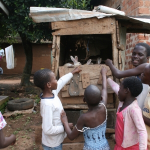 The kids at the orphanage explain their rabbit-rearing project