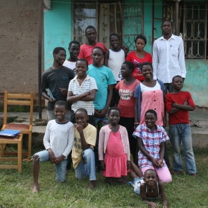 Davis and kids in front of the orphanage