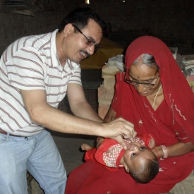 An IVC physician immunizing a young patient.