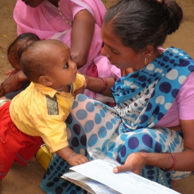 A mother and child who receive healthcare through an IVC mobile clinic.