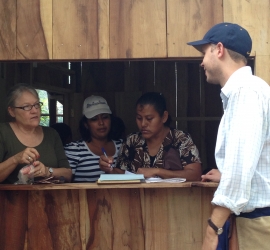 Women making monthly loan payments as part of SHI's micro-enterprise program.