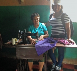 An SHI micro-enterprise participant with a sewing business.