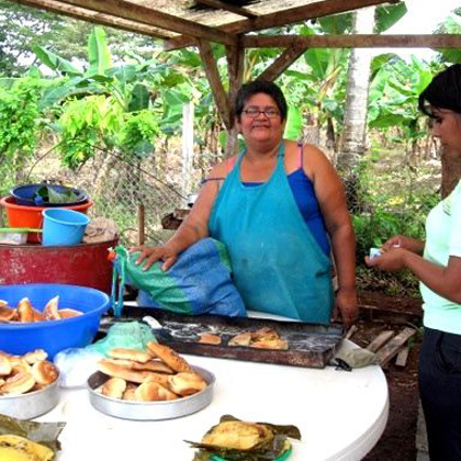 PRIMATIVA: The enticing aroma of onion bread attracts customers (and GSB Alums) to the baked goods sold in the local market by Primativa, a recent graduate of the SHI micro-enterprise program.